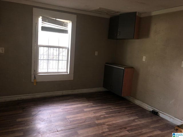 empty room featuring dark hardwood / wood-style floors