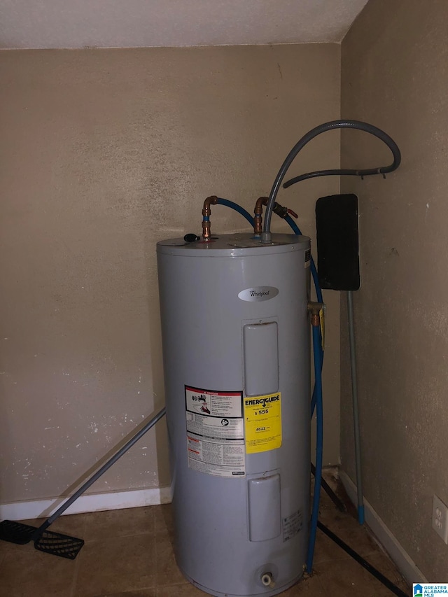 utility room featuring water heater