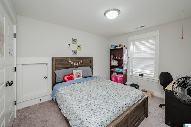 bedroom with light colored carpet