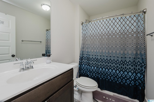 bathroom with walk in shower, vanity, and toilet