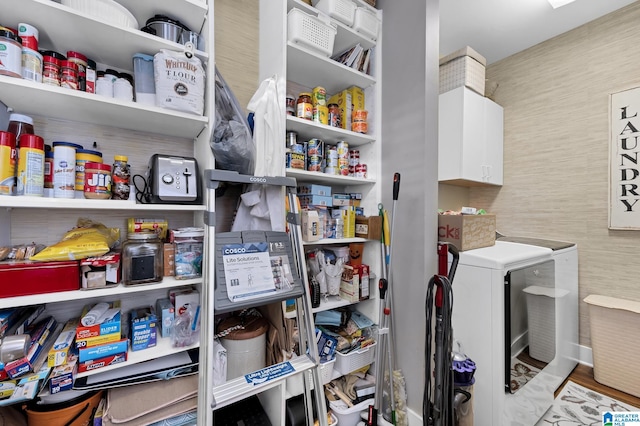 pantry featuring washer and dryer