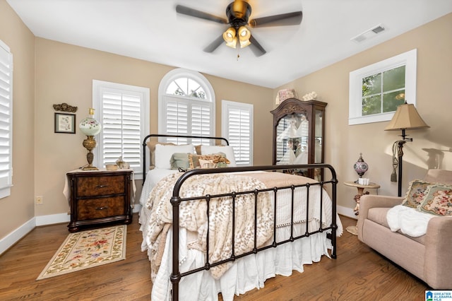 bedroom featuring ceiling fan and hardwood / wood-style flooring