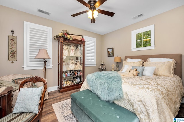 bedroom featuring dark hardwood / wood-style flooring and ceiling fan