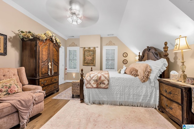 bedroom featuring vaulted ceiling, ceiling fan, and light hardwood / wood-style flooring