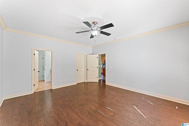 spare room with ceiling fan, crown molding, and dark hardwood / wood-style flooring