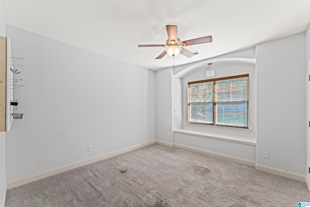 empty room with carpet floors and ceiling fan