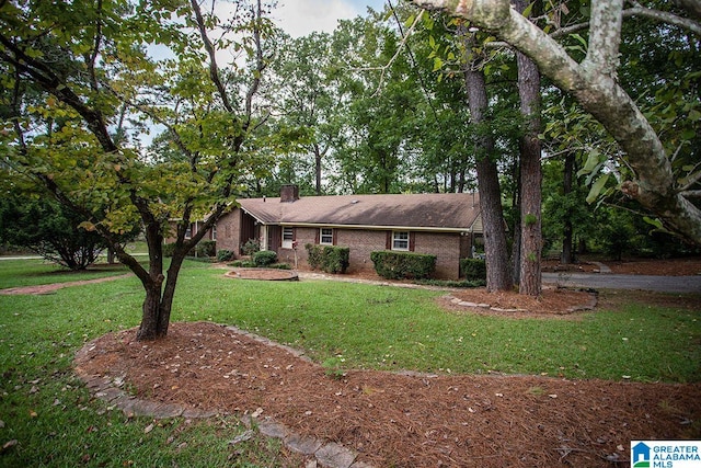 ranch-style house with a front lawn