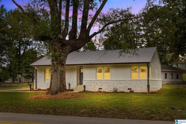 view of front of home with a lawn