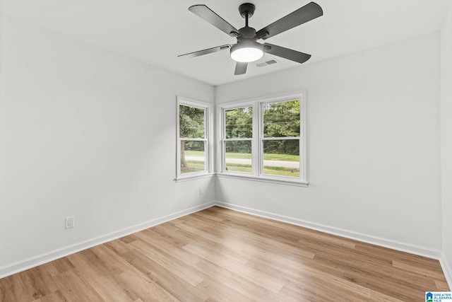 spare room featuring light wood-type flooring and ceiling fan