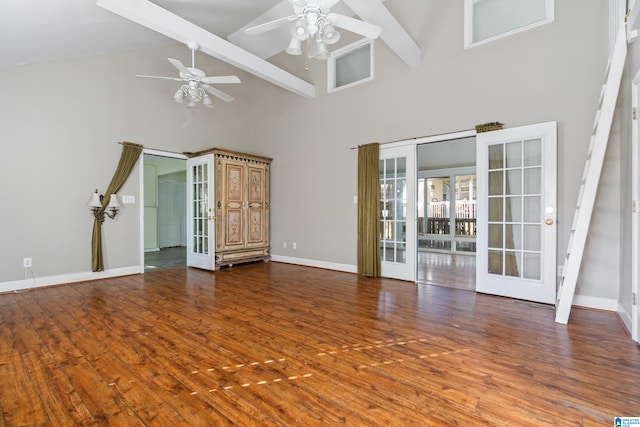 unfurnished living room with dark hardwood / wood-style floors, high vaulted ceiling, beam ceiling, and ceiling fan