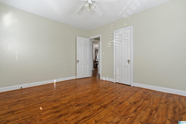 unfurnished room featuring ceiling fan and hardwood / wood-style flooring