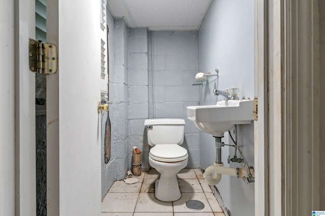 bathroom featuring tile patterned flooring and toilet