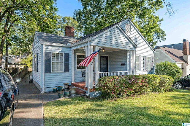 bungalow with a front yard