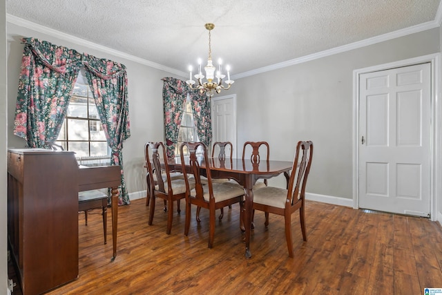 dining area with hardwood / wood-style flooring, crown molding, an inviting chandelier, and a textured ceiling