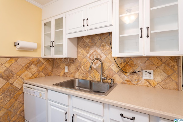 kitchen featuring decorative backsplash, white cabinetry, dishwasher, crown molding, and sink