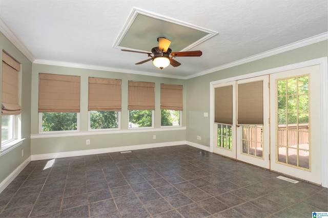 unfurnished sunroom featuring ceiling fan