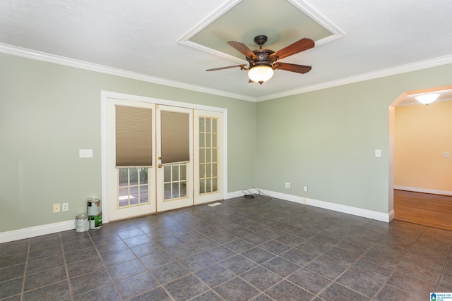 empty room with ceiling fan and crown molding