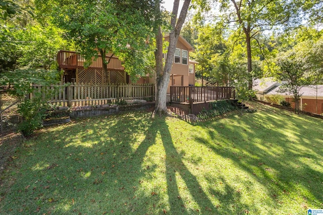 view of yard featuring a wooden deck