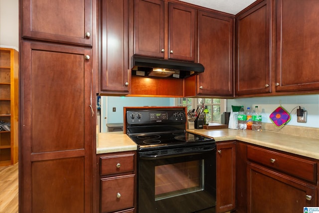 kitchen with light wood-type flooring and black electric range