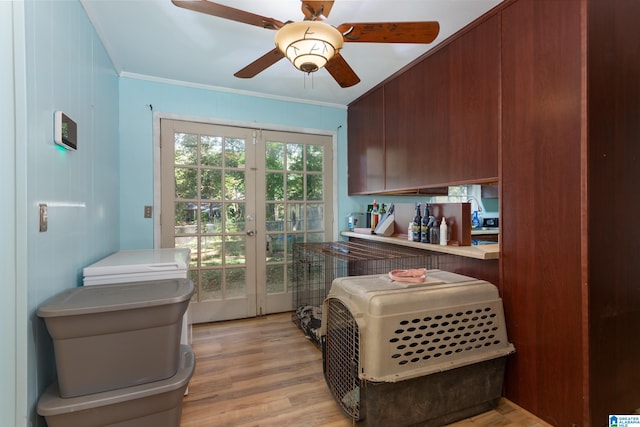 interior space with ornamental molding, ceiling fan, light hardwood / wood-style flooring, and french doors