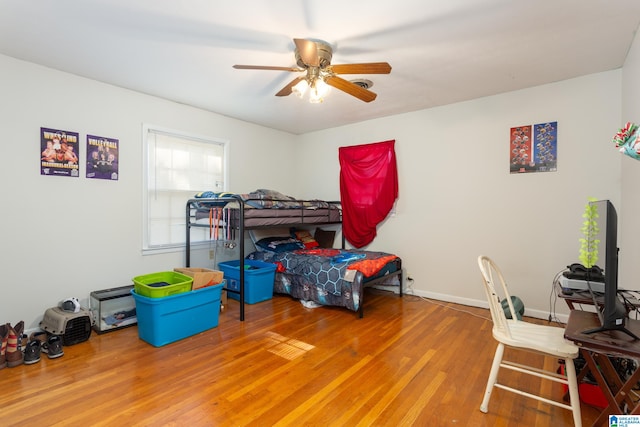 bedroom featuring ceiling fan and hardwood / wood-style floors