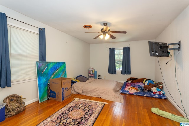 bedroom featuring ceiling fan and hardwood / wood-style flooring