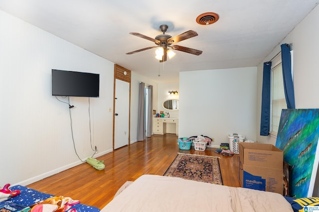 bedroom featuring hardwood / wood-style floors and ceiling fan