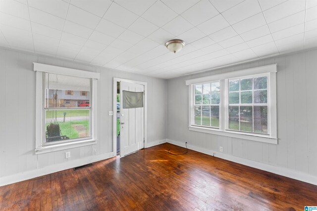 spare room featuring dark hardwood / wood-style floors