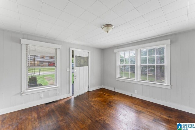 spare room featuring dark hardwood / wood-style floors