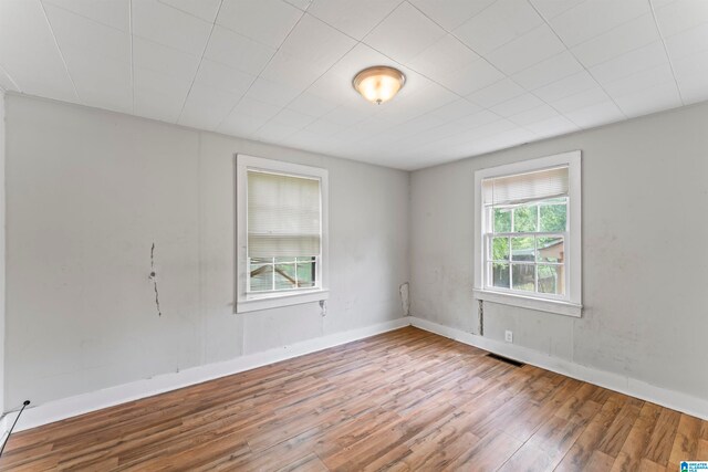 spare room with hardwood / wood-style flooring