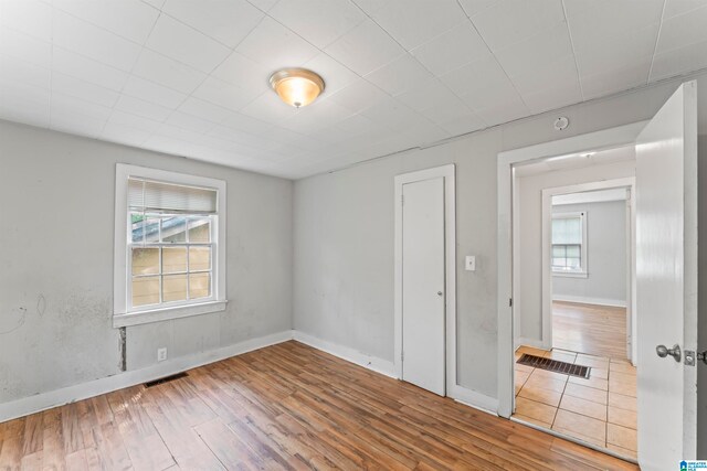 spare room with hardwood / wood-style flooring