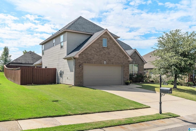 view of front facade with a garage and a front lawn