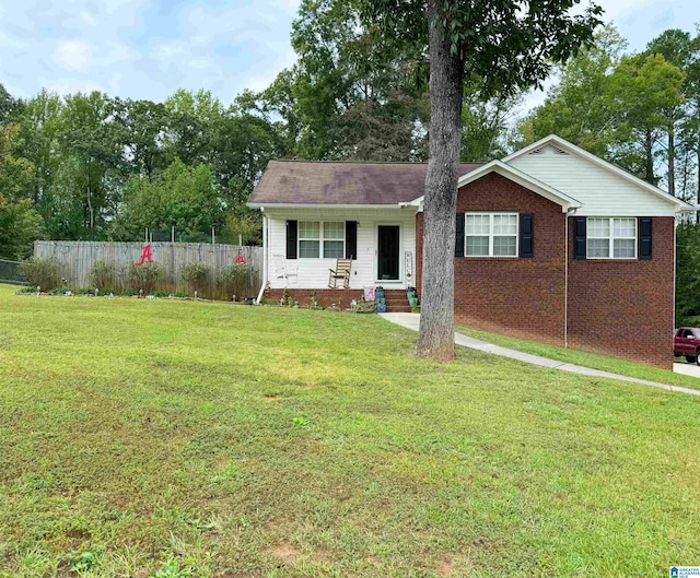 ranch-style home with a front lawn