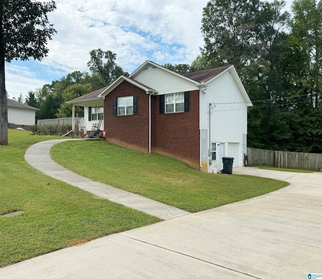 view of side of home with a yard