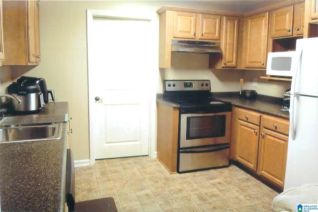 kitchen with white appliances and sink