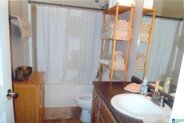 full bathroom featuring vanity, shower / bath combo with shower curtain, toilet, and tile patterned flooring