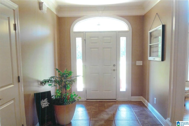 foyer entrance featuring ornamental molding and plenty of natural light