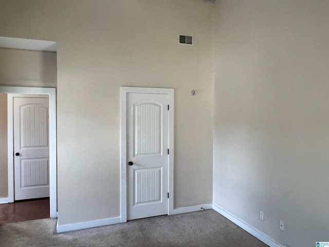 empty room featuring carpet flooring