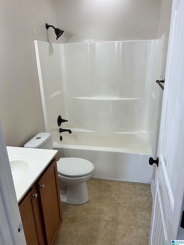 full bathroom featuring tub / shower combination, vanity, toilet, and tile patterned floors