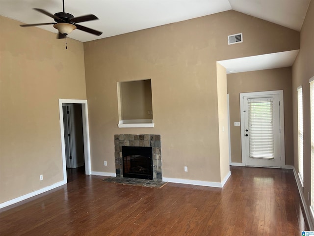 unfurnished living room with high vaulted ceiling, ceiling fan, a fireplace, and dark wood-type flooring