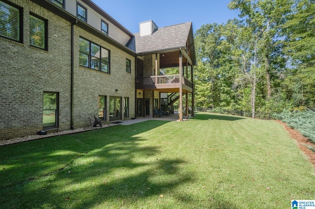 view of yard featuring a wooden deck