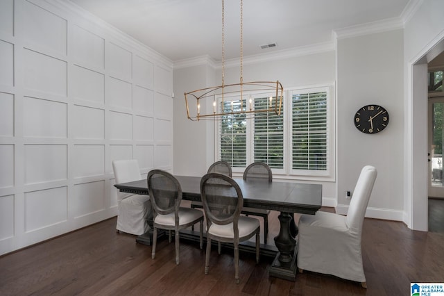 dining space with crown molding, dark wood-type flooring, and an inviting chandelier