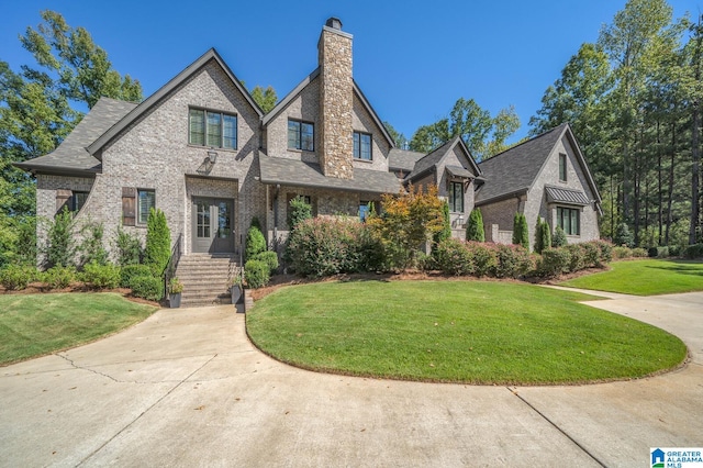 tudor house featuring a front lawn