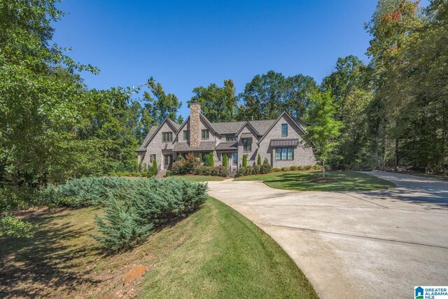 tudor house featuring a front yard