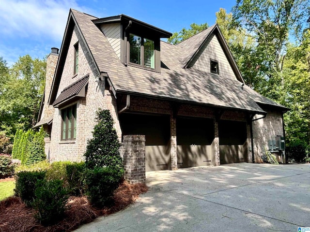 view of side of property with a garage