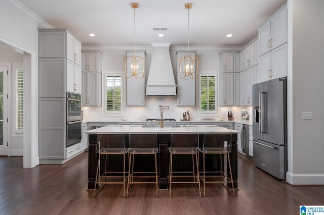 kitchen featuring custom range hood, dark hardwood / wood-style flooring, stainless steel appliances, and a kitchen island with sink