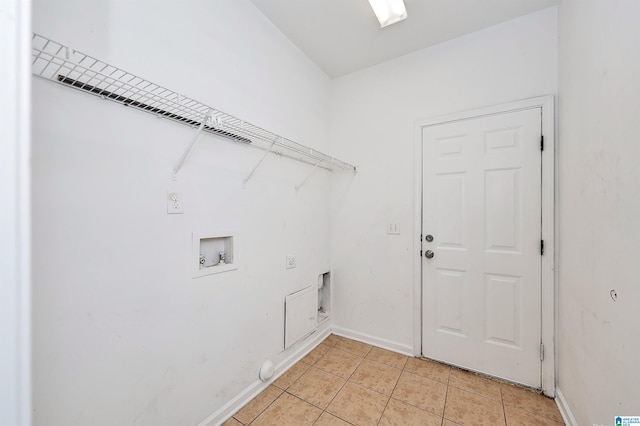 laundry room featuring hookup for a washing machine, light tile patterned floors, and electric dryer hookup