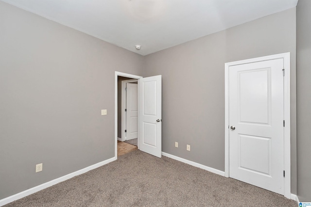 unfurnished bedroom with carpet flooring