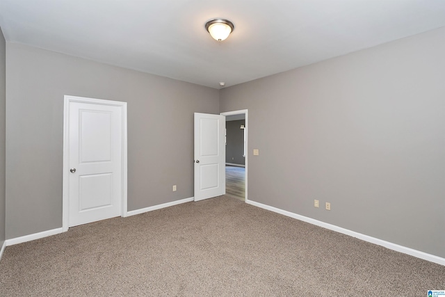 unfurnished room with carpet flooring