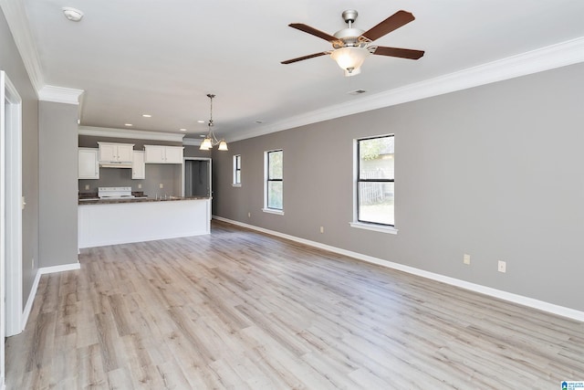 unfurnished living room with ornamental molding, light hardwood / wood-style flooring, and ceiling fan